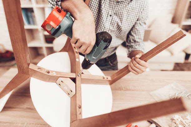 Assembling furniture with screws and a power drill